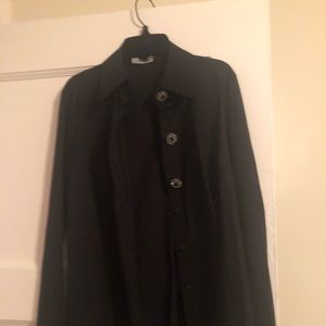 A beautiful black blouse with bejeweled buttons